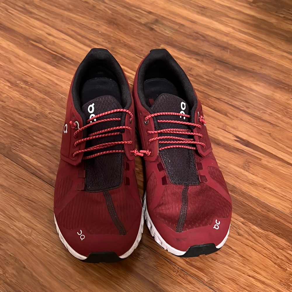 Red on cloud tennis shoes